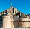 1 Top 10 Hoogtepunten van Normandië Deze grillige rotspartij met een prachtige abdij, een van de spectaculairste bezienswaardigheden van Normandië, lijkt zich zo te verheffen uit het omringende