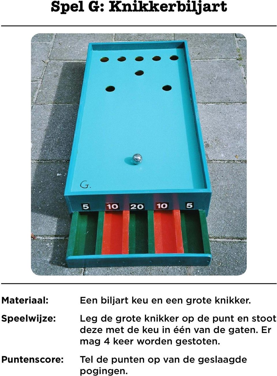 Leg de grote knikker op de punt en stoot deze met de