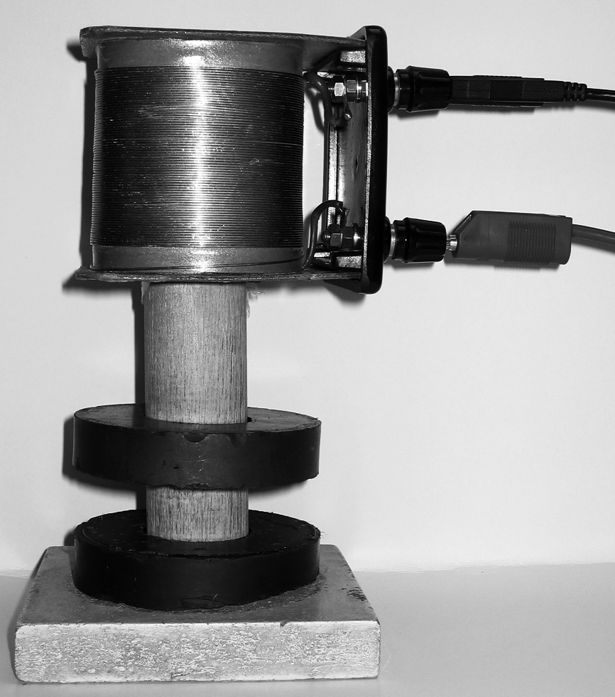 Opgave 4 Magneten In de foto van figuur 10 zie je twee identieke, ringvormige magneten om een houten stok.