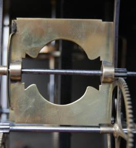 This Comtoise clock runs for a month and has a cast brass fret with an