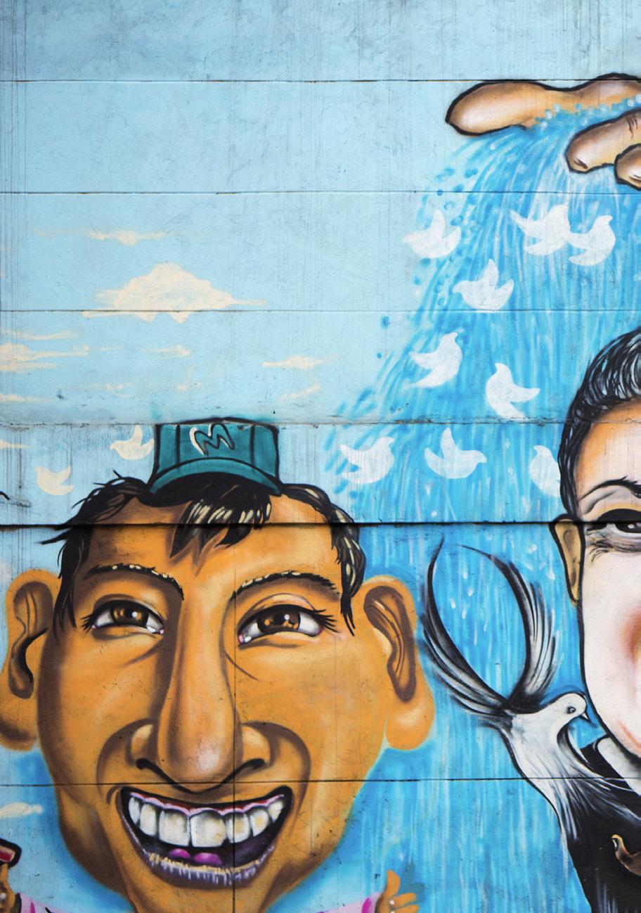Muurschildering in Bogotá met wielrenner