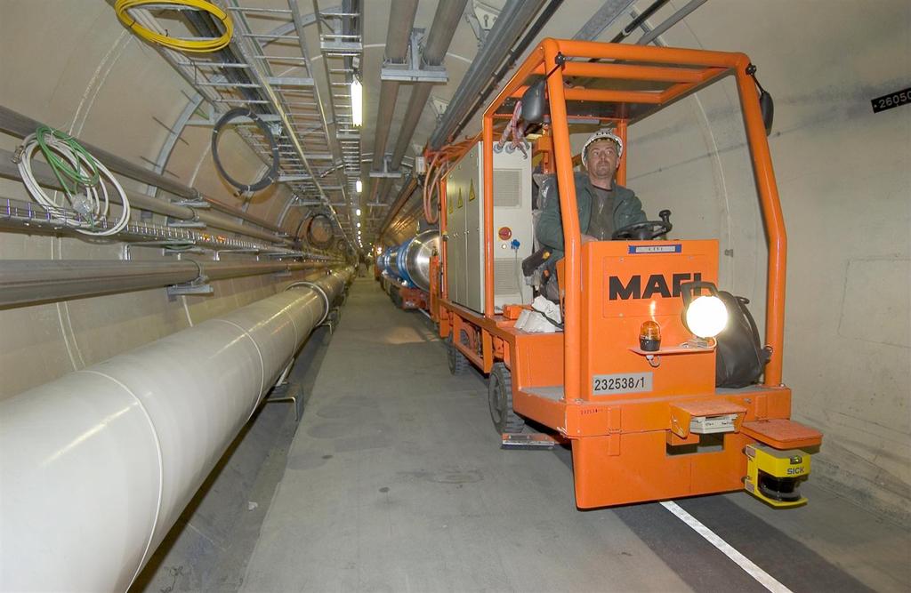 March 2005:The first superconducting magnet is transported to its final location in the LHC tunnel using a specially designed vehicle.