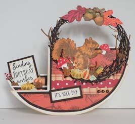 5 cm Craftables: CR1420 (Stansmal- Herfst), Tiny s layered clear stamps: TC0856 (Eekhoorn), Dessinpapier bloc: PK9138 (Canadian fall), Distressinkt: carved pumkin, festive berries, forest moss,