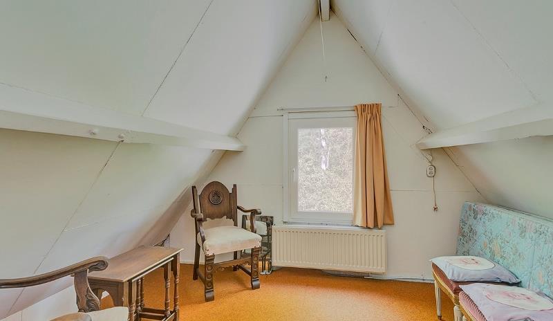 De eerste slaapkamer aan de achterzijde is