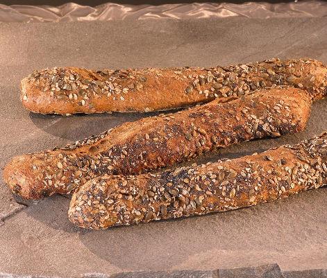 Bouchetta Cerealia Een tarwe baguette op basis van zuurdesem waarvan het deeg rijkelijk is gevuld met zonnebloempitten, aardappelvlokken, rogge en lijnzaad.