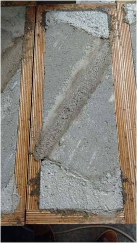 Door de lage hechtsterktes (vooral waargenomen bij de betonstraatstenen) en de grote invloed van kleine variaties op de rechtlijnigheid van de trekbelasting [4], werd ook een aangepaste methode