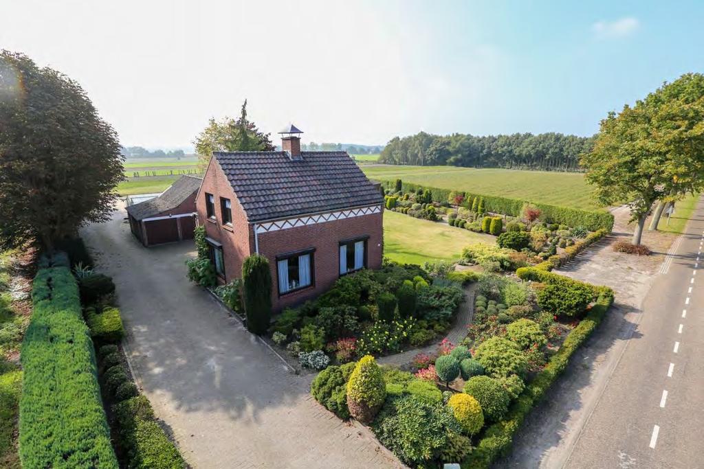 Vrijstaande woning met met schuur/garage en zeer ruim perceel grond Mooi gelegen op 17.365 m² op korte afstand van natuurgebied de Pannenhoef op een rustige, sfeervolle en groenrijke locatie.