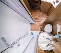 Douchecomfort in een wandomdraai: In de vario comfortbadkamer ontstaat een ruime douche, als u de wasbakwand compleet met 90 graden in de richting van de