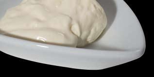 E NGELAND Clotted Cream Bak Traditionele Clotted Cream bevat minimaal 55% melkvet.