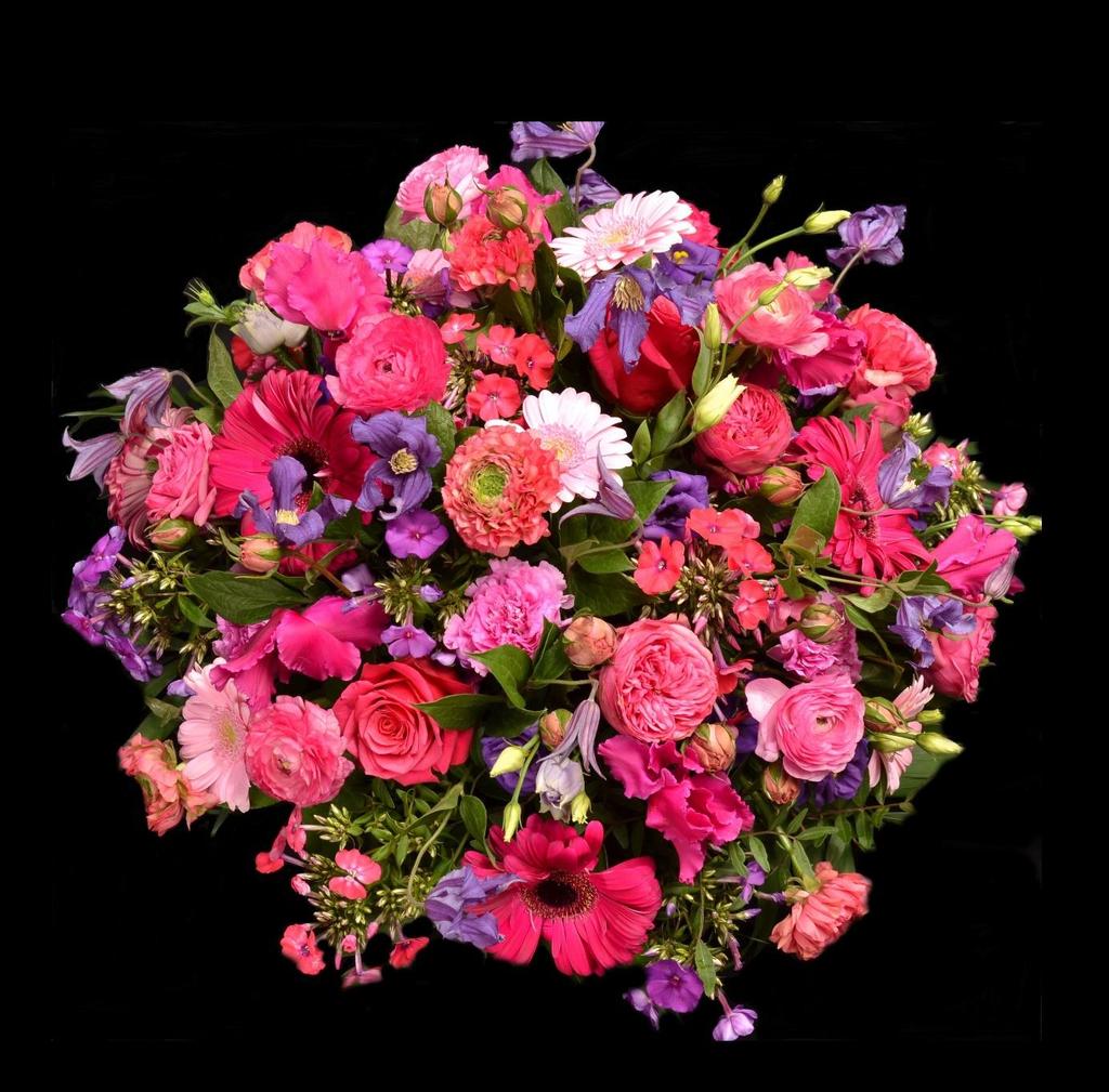 Rouwarrangement Roze/paars 50009 Los en luchtig gestoken rond stuk met roze en paarse bloemen