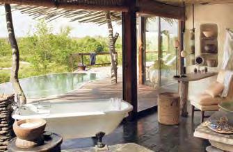 Singita Boulders Lodge: Design elementen gemixt met traditionele Afrikaanse elementen. 12 ruime suites bestaande uit living, slaapkamer, dressing en ruime binnen- en buitenbadkamer.