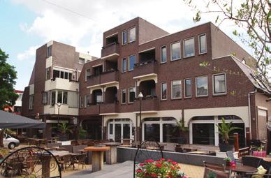 winkels met 14 appartementen en 47 parkeerplaatsen/garages Bouwjaar: 1976