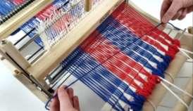 Since the weft thread goes over and under every other warp thread, the actual length of weft thread needed is greater than the width of the warp.