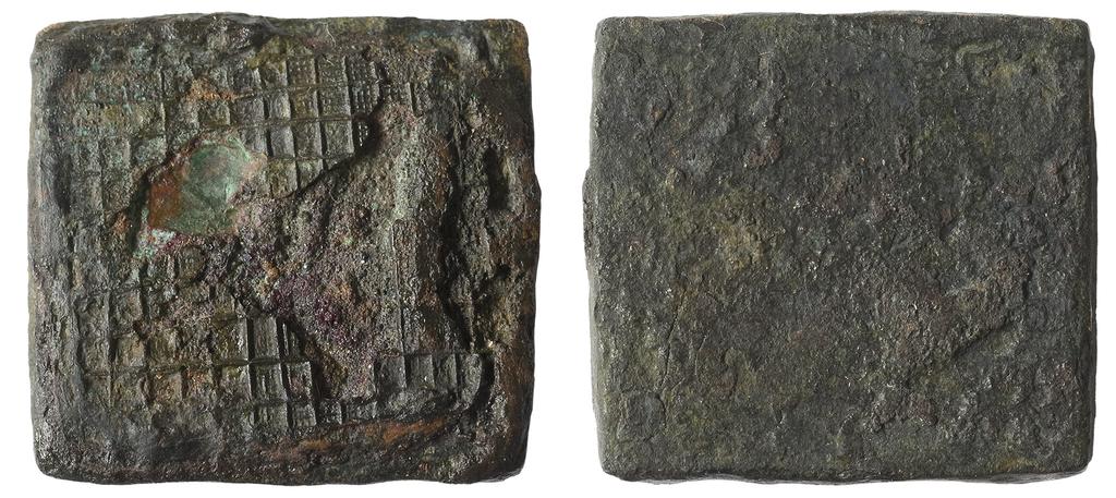Wijnaldum: koningsterp aan de Ried 7 Fig. 6 Voor- en achterzijde van een kleine bronzen stempel uit Wijnaldum-Tjitsma.