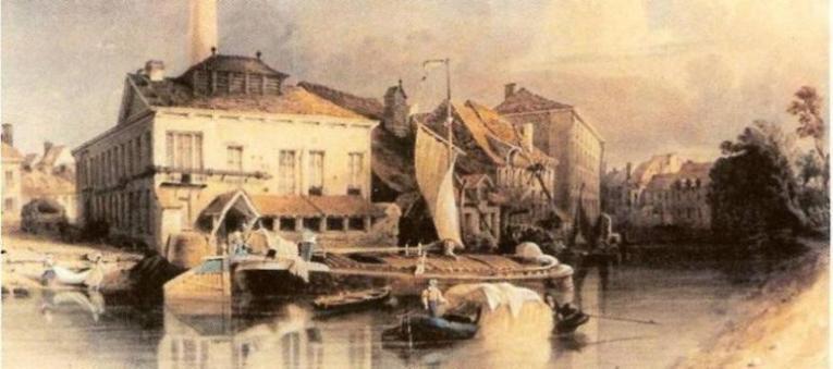 Hier zien we zijn eerste fabriek aan de Waalse Krook aan de Muinkschelde (zicht vanaf het winkelcentrum zuid). De fabriek uit 1824?(1820?