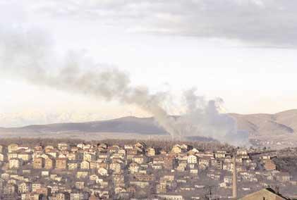 Communautair ontwikkelingsbeleid en tenuitvoerlegging van de buitenlandse hulp MILIEU 66 Zware vervuiling boven Pristina (Kosovo).