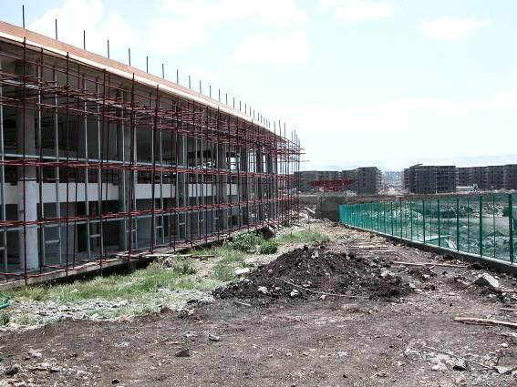 The first picture on this page shows the east side of the Library with on the right hand side the fence around the