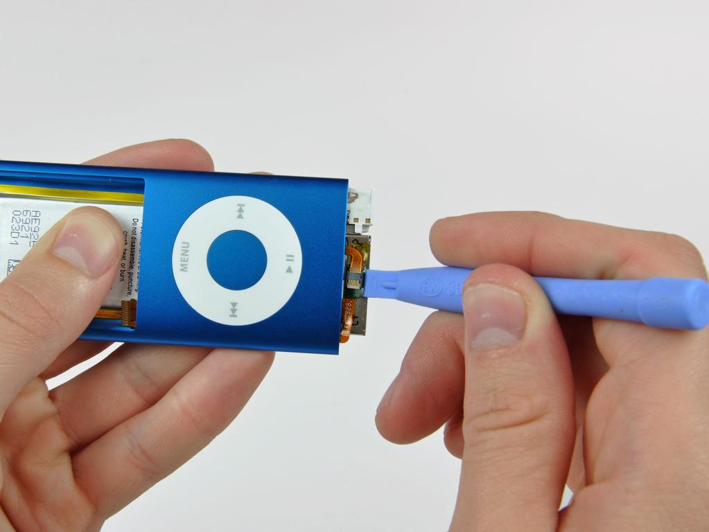 Stap 17 Gebruik de rand van een ipod opening tool om de click wheel lint