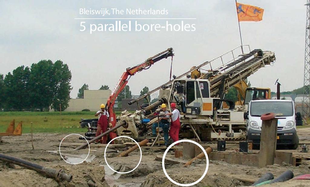 Parallel drilling under a combination of a railway, a highway and cathodic protected metal pipes was difficult with steering tools, such as magnetic steering tools.