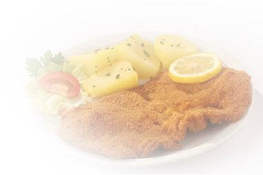 Schnitzelspecialiteiten Worden geserveerd met frites, gebakken aardappels warme groenten en rauwkost Onze wintertopper Schnitzel met rode portsaus Saus gevuld met appel, spekjes, champignons, ui en