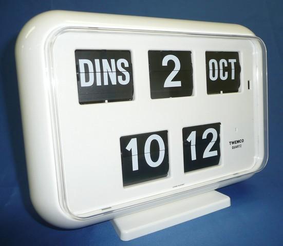 Dag, datum en maand worden weergegeven in het NEDERLANDS (grote witte cijfers en letters op