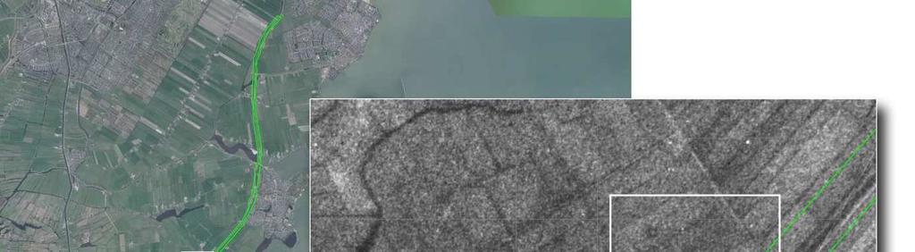 Figuur 51. Verstoringen op de luchtfoto uit 1940. Bron satellietbeeld: World Imagery. Bovenstaande afbeelding toont een patroon van donkere vlekken, mogelijk kraters van afwerpmunitie.