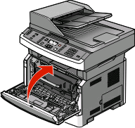 Plaats de fotoconductorkit en de tonercartridge terug in de printer. Druk op de knop onder aan de fotoconductorkit.
