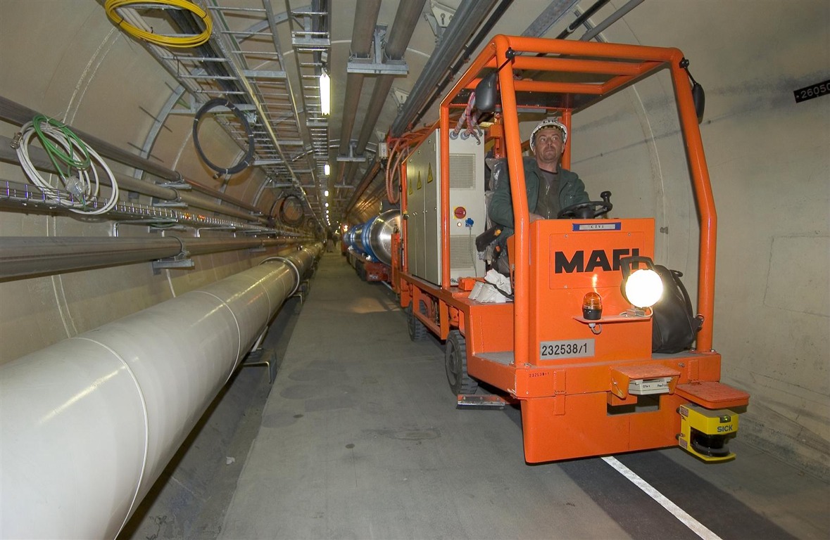 March 2005:The first superconducting magnet is transported to its final location in the LHC tunnel using a specially designed vehicle.