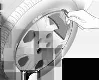 190 Verzorging van de auto 1. Stalen velgen: Wieldop verwijderen met de haak. Boordgereedschap 3 177.
