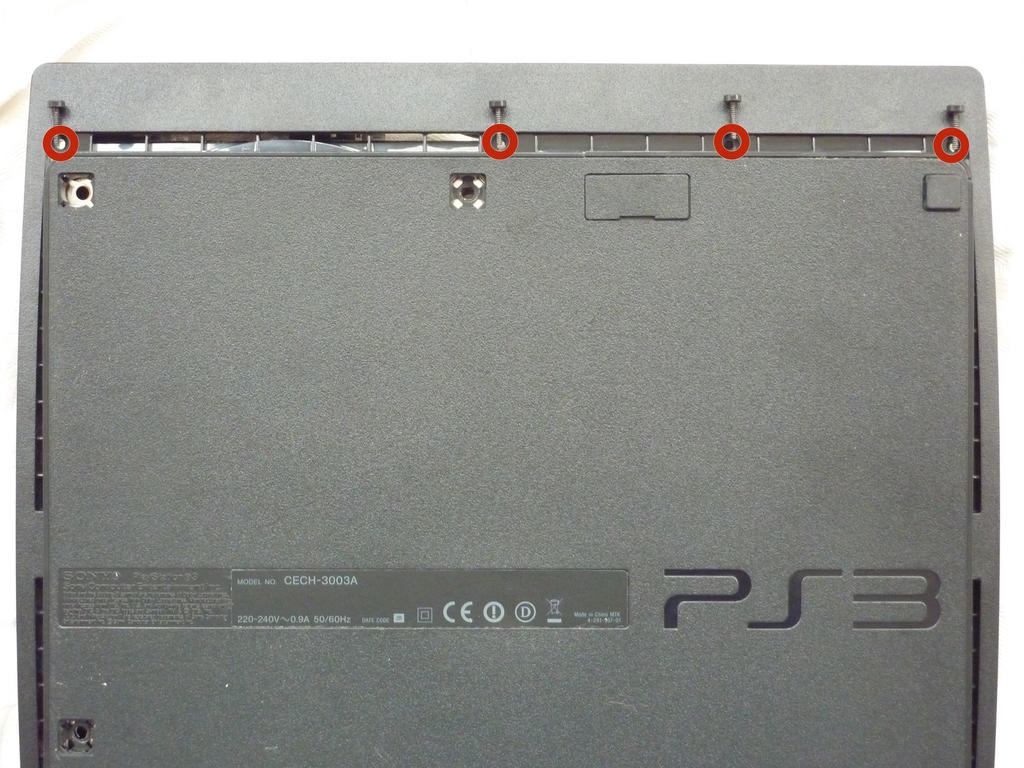 PlayStation 3 Slim Blu-ray Disc Drive Vervanging Stap 3 Verwijder de zeven 37 mm Phillips schroeven waarmee de bovenklep om de kleine letters.