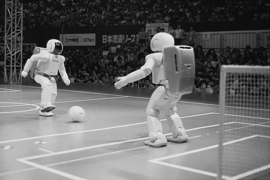 Voetballende robots In de afbeelding zie je voetballende robots. Op hun rug dragen ze batterijen. In de batterijen worden stoffen omgezet in elektrische energie.