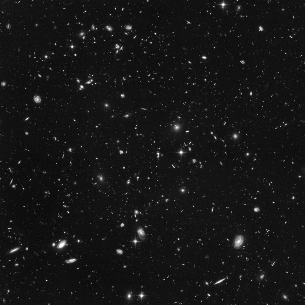 2 CHAPTER 1. NEDERLANDSE SAMENVATTING Afbeelding 1 Sterrenstelsels in de Hubble Ultra Deep Field (HUDF) gezien met de Hubble ruimtetelescoop.