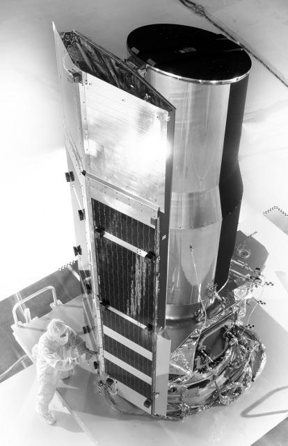 195 kunnen worden om de verschillende onderdelen van protoplanetaire stofschijven te onderzoeken. Figuur 2 De Spitzer Ruimteteleskoop (Credit: NASA).