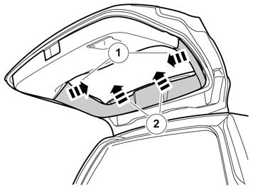 7 Verwijder aan beide kanten de schroef aan de onderkant van het bovenste paneel van de achterklep.