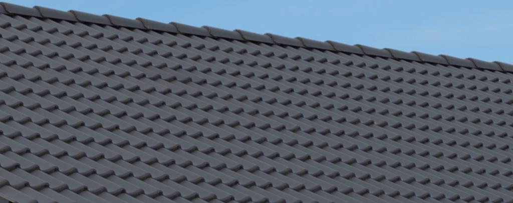 De structuur van een Aerlox dakpan is open: hoogwaardig cement en kleine holtes wisselen elkaar af.