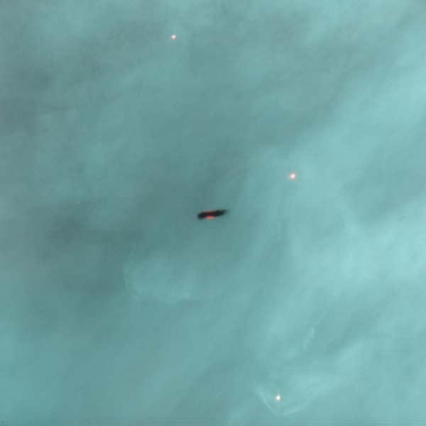 Nederlandse samenvatting 143 Figuur S.2 Een afbeelding van de zijkant van een protoplanetaire schijf, genomen met Hubble ruimtetelescoop in zichtbaar licht.