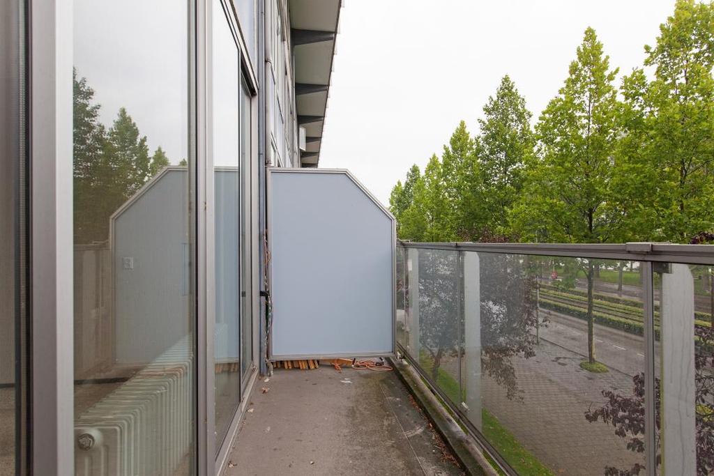 Balkon met uitzicht op de Sloterplas Op het noordoosten