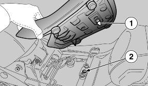 Lift and remove the saddle. UPON REFITTING: BEFORE LOWERING AND LOCKING THE SADDLE, CHECK THAT THE KEY HAS NOT BEEN LEFT INSIDE THE GLOVE-BOX / TOOLKIT COMPART- MENT.