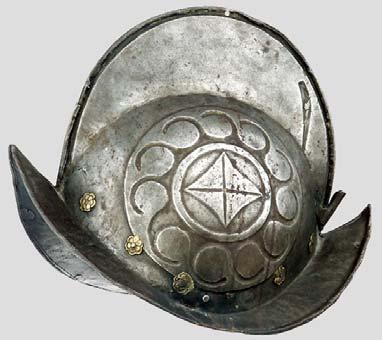 A decorated morion, Brescia, circa 1590 The heavy, single-piece skull with typical stalk in the apex and brim with turned under and roped edge, the entire surface covered with a