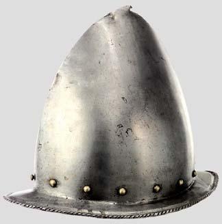 A South German black-and-white comb morion, circa 1610, probably Nuremberg, formed in two-pieces joined by a tall roped comb, embossed on each face with a large fleur-de-lys against