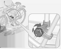 Eerste fiets bevestigen Duw de drager omlaag (1) en draai de draaihandgreep (2)