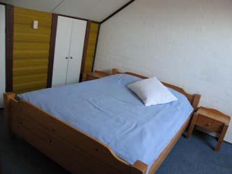 Slaapkamer IV: De ruime slaapkamer is geïsoleerd en afgetimmerd, VELUX