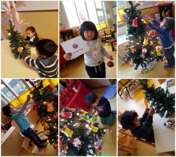 Dit jaar hebben we gekozen voor een kindvriendelijke boom, zonder breekbare kerstversiering. De peuters hebben een kerstklok geverfd en zelf in de boom opgehangen.