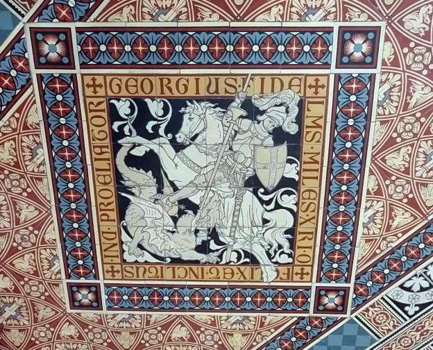 De tegelvloer op het altaar met afbeelding van de Heilige Georgius. In de tegelvloer is sint Joris met de draak afgebeeld. Waarschijnlijk is st. Joris de patroon heilige van de st. Josefkerk.