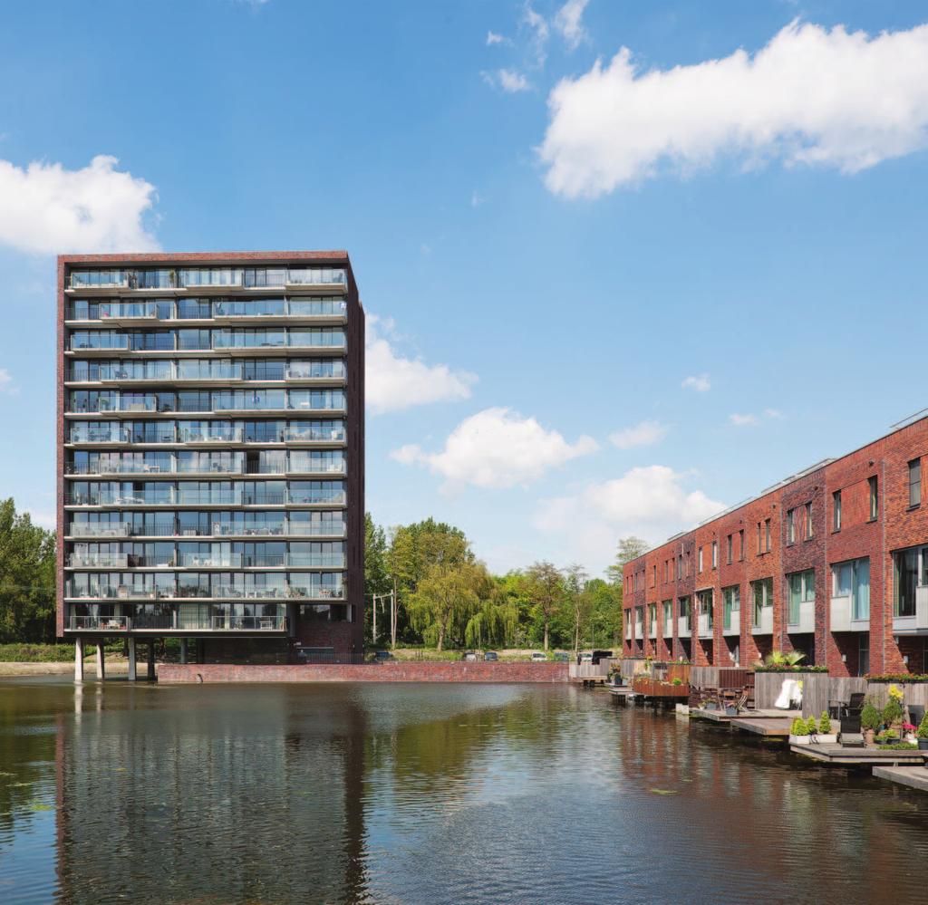 Parkvenster wurck architectuur stedenbouw landschap WONEN AAN HET WATER Het architectonisch ensemble van Kadewoningen en Watertoren vormt samen met een serene waterpartij het Parkvenster.