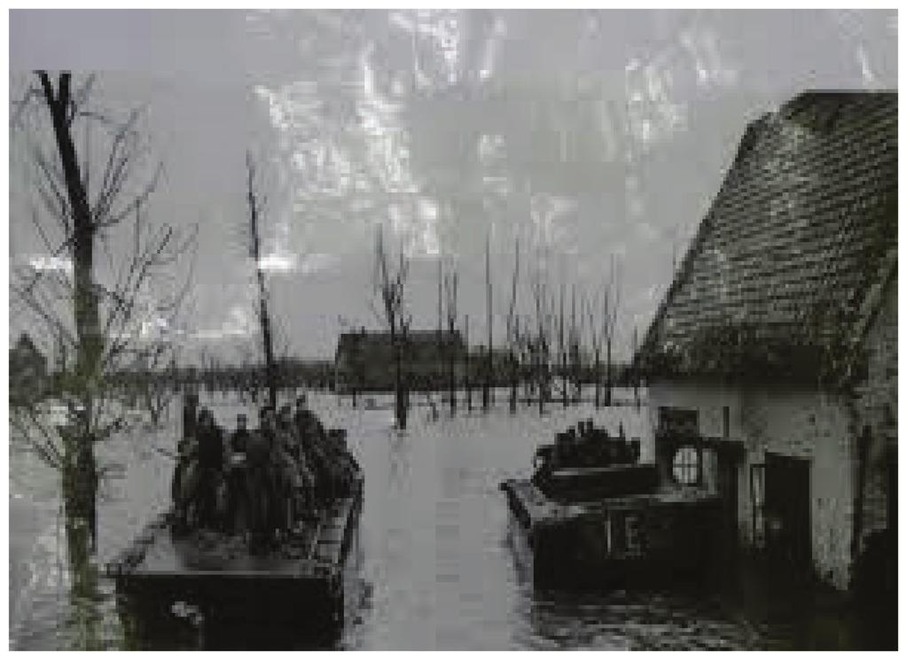 Inzet Buffalo's De 3 e Canadese Divisie trok op door geïnundeerd gebied. De Waaldijk bij Erlecom was door de Duitsers opgeblazen en het totale gebied op de linkerflank stond onder water.