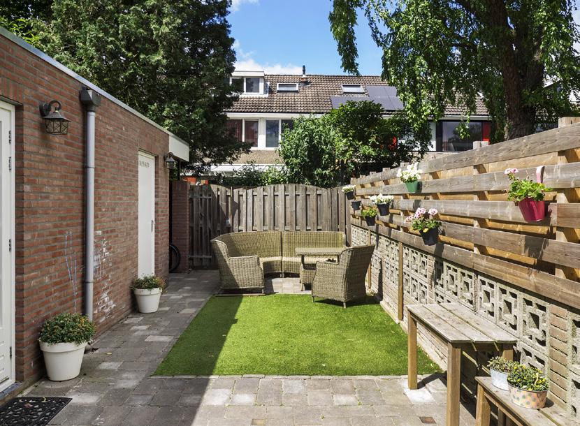 Garden Garden: Easy to maintain deep backyard facing Northwest with a terrace, artificial