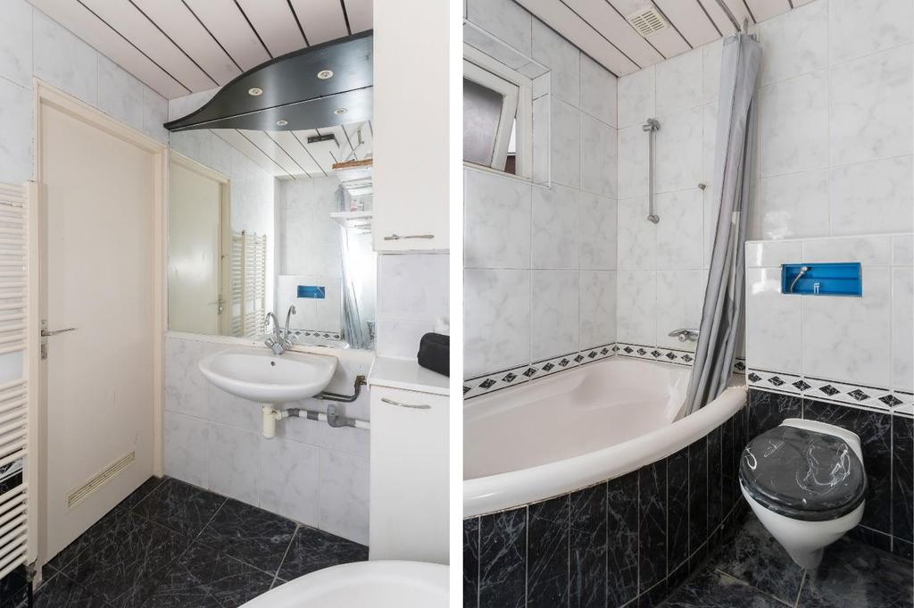 Functionele badkamer met zitbad met