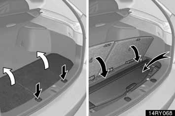 INTERIEUR 145 VLOERMAT De bagageafdekking kan worden opgeborgen in het extra opbergvak in de bagageruimte, zoals aangegeven in de afbeelding.