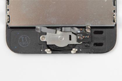 - Leg vervolgens de home button houder bovenop de home button.